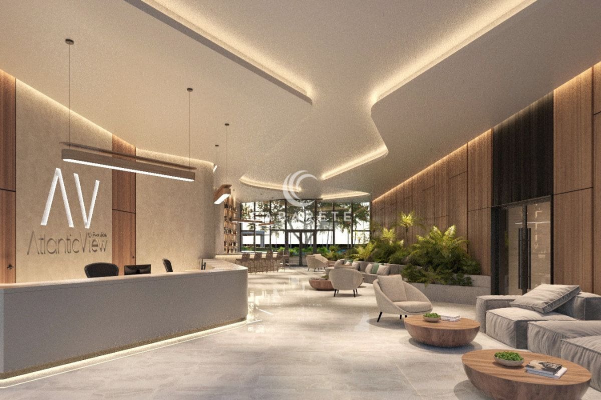 Die Atlantic View Residence, ein luxuriöses Anwesen am Strand von Cabarete, verfügt über eine einladende Lobby mit Rezeption und bequemen Sitzgelegenheiten.