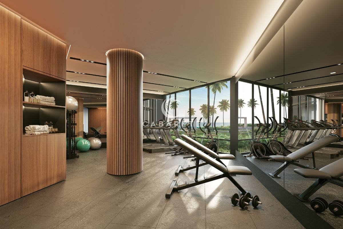 Atlantic View, eine luxuriöse Strandresidenz in Cabarete, bietet einen Fitnessraum mit atemberaubendem Meerblick und modernen Trainingsgeräten